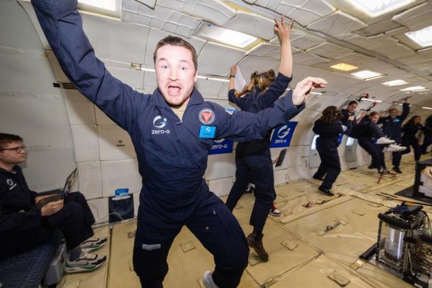 Colt D. Crowson, 2d Lt, USAF, AFIT AAE MS, floating in a microgravity simulator. (Courtesy photo)