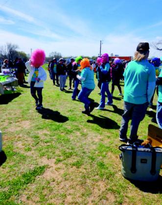 Guests strut their crazy colored wigs. Courtesy photos