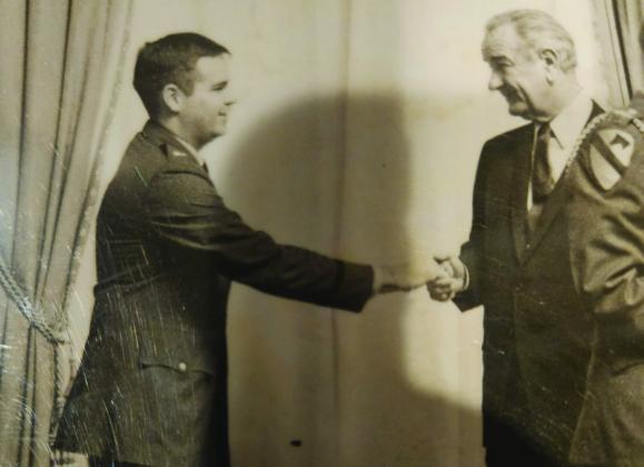 Ron Frost shaking hands with President Lyndon B. Johnson at a Medal of Honor ceremony. Courtesy photo