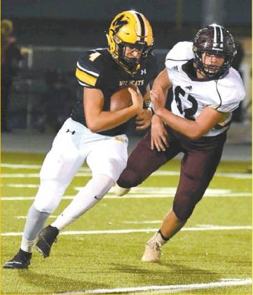 Dibbon Marris • Courtesy Photo Madill Sophomore quarter back Kendall Robertson scrambles during the Oct. 17 game against Blanchard.