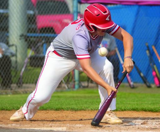 Ethan Mowles goes for a bunt. Matt Swearengin