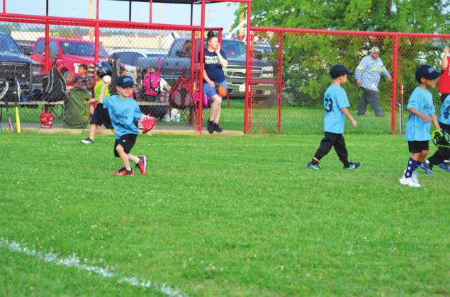 A player prepares to throw the ball during a Kingston Youth Association T-ball game on May 21. Matt Caban • The Madill Record