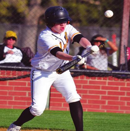 Jackson Roberts bunts the ball during a Madill Baseball game. The Wildcats won all three games on April 6 and April 9, 2021. Summer Bryant • The Madill Record
