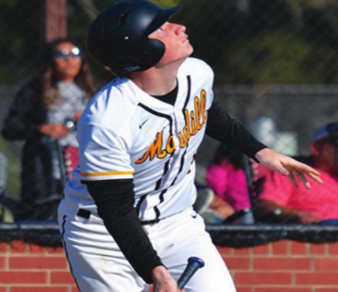 Steven Sisco hits a popfly during a Madill Baseball Game. Summer Bryant • The Madill Record