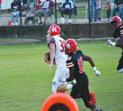 Kingston senior running back Matthew Flesher (#35) pulls away from Idabel junior Aijon Jones (#10) and sophomore Radale Larry (#2) on his way to his second touchdown of the night. Linda Holmes