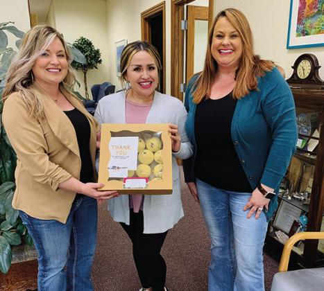 To show The Madill Tag Agency, left, and Marshall County Abstract, right that they are appreciated, The Madill Record delivered muffins from Sourdoe Bakery. Leslie Mowles • The Madill Record