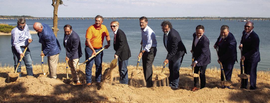 Local and state officials turned the dirt during the ground breaking ceremony for the new Roosevelt Bridge. Matt Swearingen