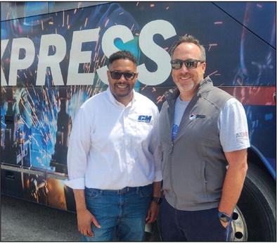 CM Truck Bed VP of Operations Money Geter, left, and AEM VP of Sales Paul Fleming are all smiles at the event. Andrea Dunlap • The Madill Record