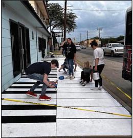 KHS Art students work on painting the piano in the front of Greg’s Rockin’ Goat Coffee Shop in Kingston. Courtesy photos