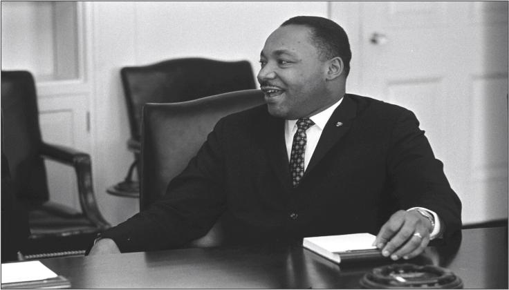 A smiling Martin Luther King, Jr. participates in a meeting in the Cabinet Room of the White House, Washington, DC, January 18, 1964. LBJ Library photo by Yoichi Okamoto