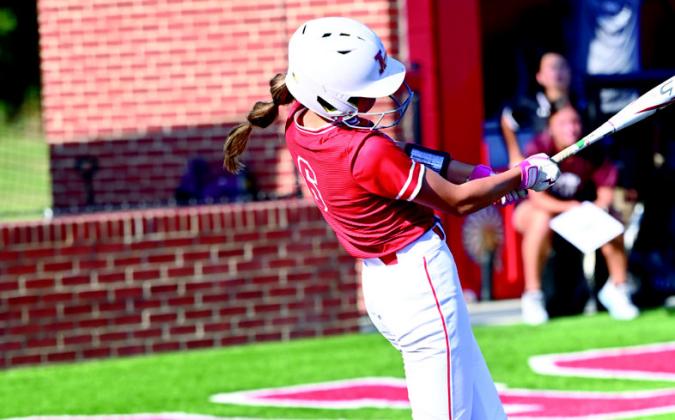 Junior Ava Bain connects for a triple. KHS Yearbook