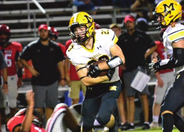 Holden McGahey runs down fi eld during the Madill vs. Pauls Valley game on October 14, 2021. The Wildcats suffered another loss agasint the Bulldogs. Summer Bryant • The Madill Record