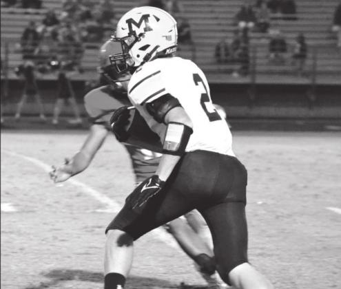 Stephen Sisco takes off carrying the ball during the October 14 game between Madill and Pauls Valley. Summer Bryant • The Madill Record