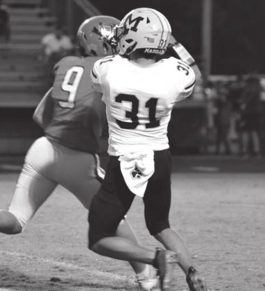 Rey Gomez catches the pass during the Madill vs. Pauls Valley game. Unfortunately, Madill lost 34-19. Summer Bryant • The Madill Record