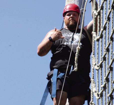 Coach Josh Sisco gets ready to tackle the rope course. Courtesy photo