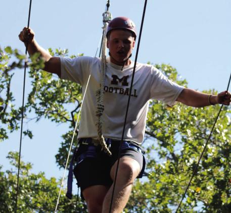 Tyce Pruitt shows complete focus while navigating the rope course. Courtesy photo