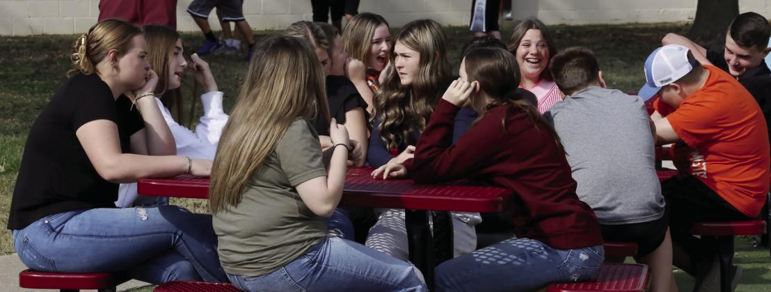 Warner middle school students spend their spare time after lunch outside chatting or playing sports. Rip Stell • Oklahoma Watch