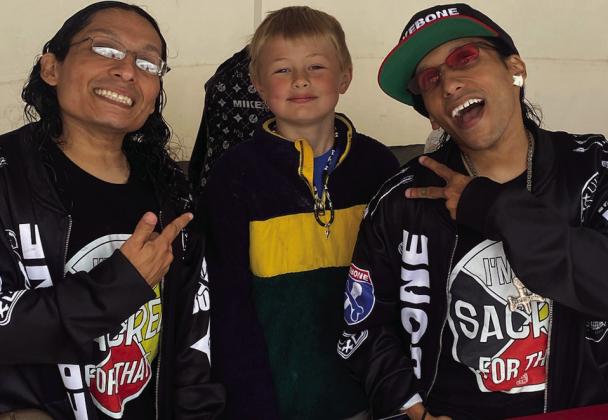 Lil Mike and Funny Bone were two performers at the 10th Annual Artesian Arts Festival. They are posing with their little fan, Caiden Latham. Tom Stewart