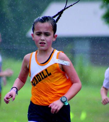 Many cross country runners persevered and ran in the rain during the Madill Cat Run. Summer Bryant