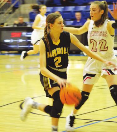 Madill guard Abbie Lambertsen (2) drives into the lane against Pauls Valley in the Regional Tournament Feb. 27. Glenn Price • The Madill Record
