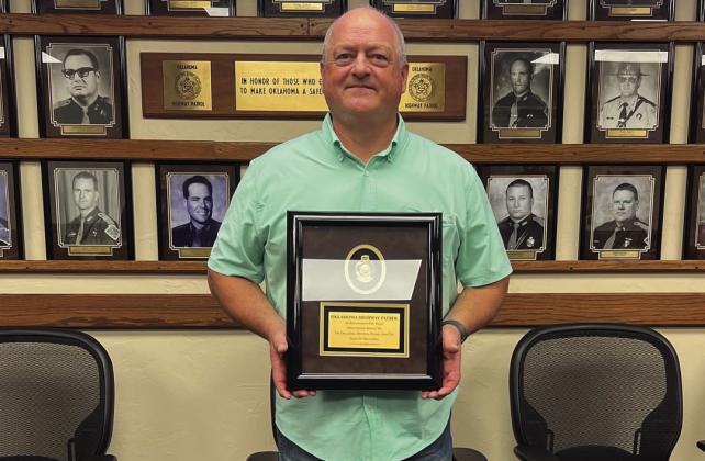 OHP Trooper Darren Alexander was presented a plaque upon his retirement from the OHP. Courtesy photo