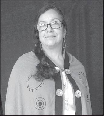 Courtesy photo Rena Smith dons a silk noil cape dyed with cochineal beetle remains, with black piping and ancient Chickasaw symbols during the 2019 Southeastern Art Show and Market in Tishomingo, Oklahoma.