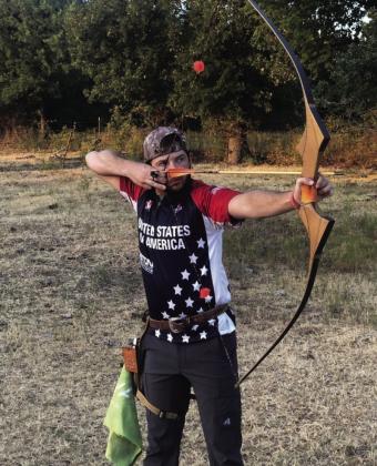 Shiloh Butts takes aim at a target in his USA team uniform. Courtesy photo