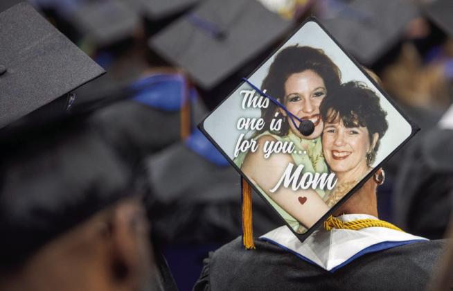 Many graduates decorated their mortarboards for commencement last Saturday at Southeastern Oklahoma State University. Matt Swearengin