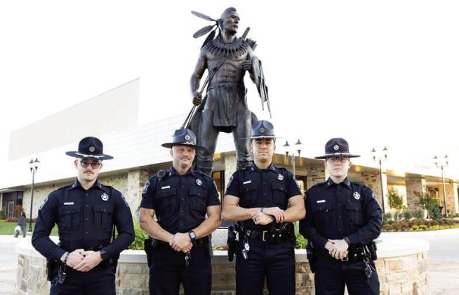 Chickasaw Lighthorse officers Tucker Pfeiffer, Harry Kelly, Gavin Aldridge and Jakub Sharp stand outside the Aiitafama’ Ishto’ (Large Gathering Place) in Tishomingo. Since being reestablished in 2004, the Chickasaw Lighthorse Police Department has grown to become a department of more than 100 sworn officers providing exceptional law enforcement. Courtesy photo