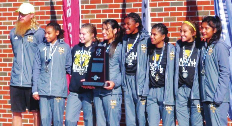 Madill head cross country coach Cale Eidson (far left) was recently named the Oklahoma Track Coaches Association girls cross country coach of the year. Courtesy Photo