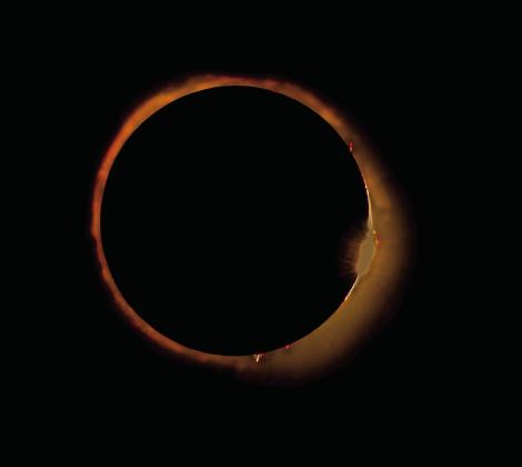 Photos by Gary Henry The total solar eclilpse, pictured left, occurred on April 8. The photo on the right is shortly after the totality when the diamond ring appeared.