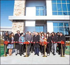 Courtesy photo Right photo: Chickasaw Nation Gov. Bill Anoatubby, center, is joined by Chickasaw Nation Lt. Gov. Chris Anoatubby, fifth from left, Chickasaw citizens, tribal elected officials and medical center staff during a Nov. 14 ribbon cutting ceremony for the new Chickasaw Nation Pharmacy Building.
