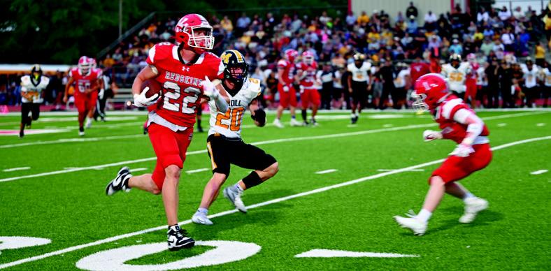 Jake Hofferber keeps his eye on the end zone. KHS Yearbook