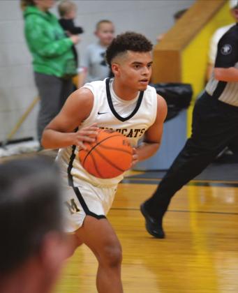 Summer Bryant • The Madill Record RJ Morris dribbles down the court during the Madill v. Tishomingo game. The Wildcats won 48 to 39 in overtime.