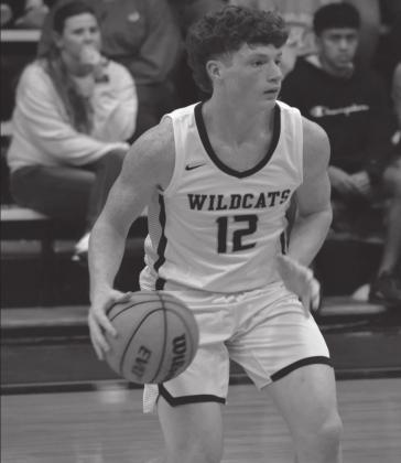 Summer Bryant • The Madill Record Stephen Sisco runs down the court in the game against Tishomingo. The Wildcats won the game in overtime.