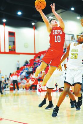 Crockett Uber • The Madill Record Kingston’s Kaden Johnson attempts a shot against a Hugo defender during the teams’ Regionals game Feb. 27.