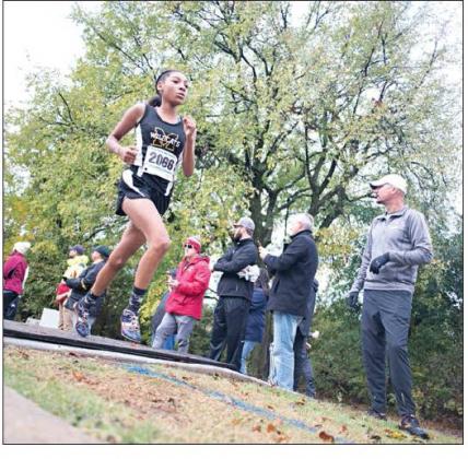 Top left: Madill feshman Mercedes Stumblingbear (2066) runs in the 2019 4A OSSAA State Championship Cross Country Meet on Oct. 26