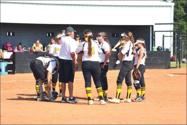 Matt Caban • The Madill Record RANDY Rushing, the Madill High School fast pitch head coach, gives his team instructions during a break in action at a July 29 scrimmage against Marietta High School. Fast pitch softball will not be impacted by pending changes to OSSAA’s classifications.