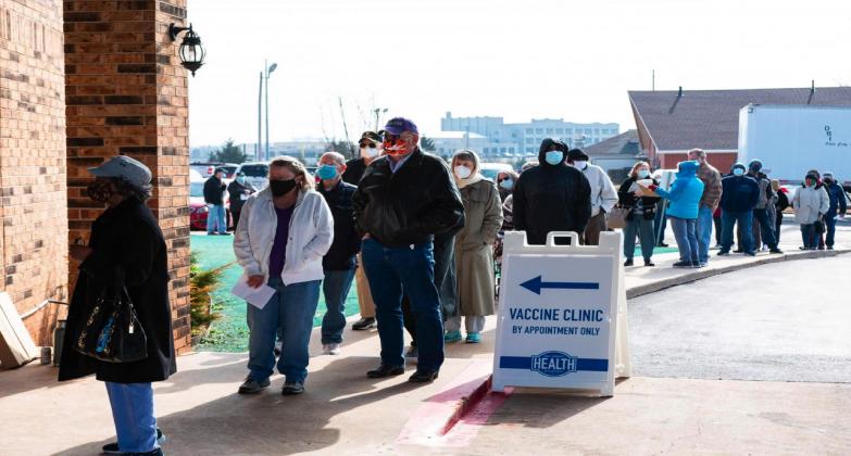 Oklahomans age 65 and older stood in line awaiting their COVID-19 vaccine at Ebenezer Baptist Church in Northeast Oklahoma City on Jan. 26, 2020. Oklahoma City County Health Department expected to administer 1,100 doses that day. Whitney Bryen • Oklahoma Watch