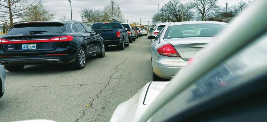 On January 18, 2021, residents line up to receive the COVID-19 vaccine. As the cars lined up in double lines, the Health Department administered the vaccine. Many residents commended the Fire Department and the Health Department for the way they handled the case load. They checked people in for their appointment time and made sure each person was registered and on the list. Judy Thompson Parkey