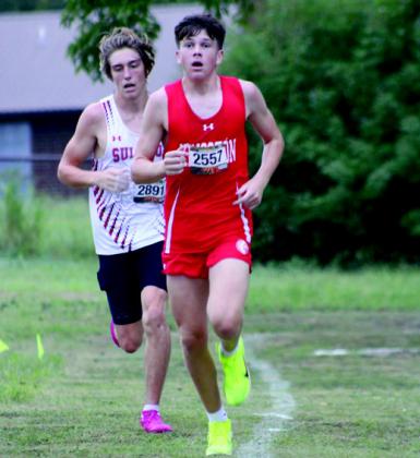 Daisy Avery, pictured left, came in 6th place in the 3200 meter course. The Kingston boys team also competed in the Madill Cat Run. Courtesy photos