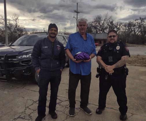 In the spirit of giving, The Madill Police Dept pulled people over to give them a ham. Courtesy photo