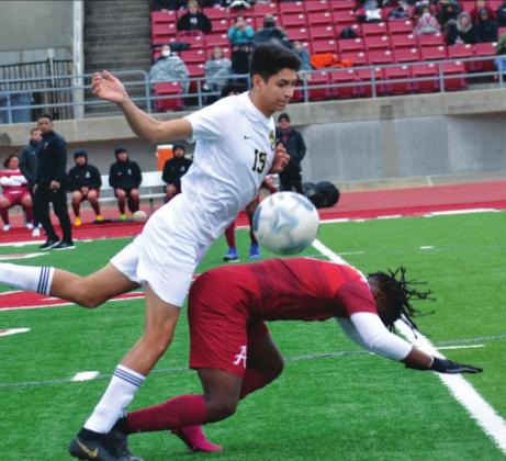 Yoyo Robles plays hard during the soccer season opener on March 2, 2021. Summer Bryant • The Madill Record