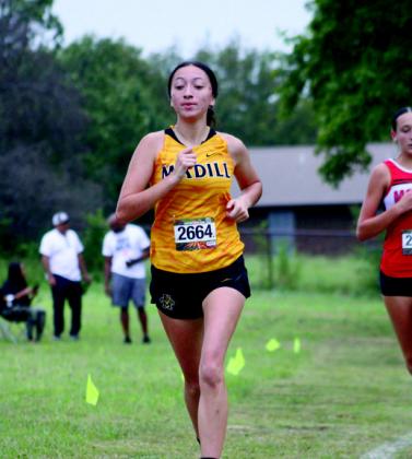 Many cross country runners persevered and ran in the rain during the Madill Cat Run. Summer Bryant