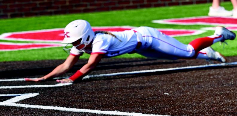 Kate Ratzlaff slides into home to help the Lady Redskins win at the RSU Festival. KHS Yearbook