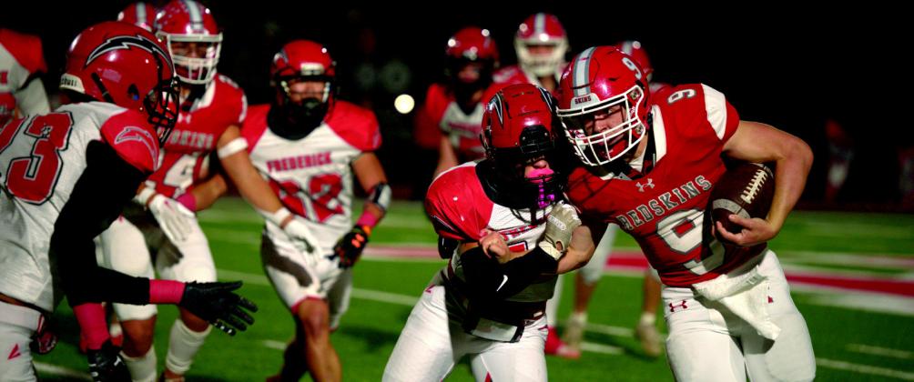Sophomore Reed Patterson breaks through the defensive line during the Kingston v. Frederick game. Rylee Goree