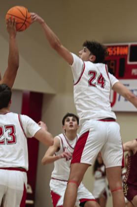 On January 26, both Kingston teams beat Marietta. The boys won 62 - 41 and the girls won 54 - 18. Pictured left: Coby Davis guards her opponenent pictured right: Reid Cason jumps to take control of the ball. Courtesy photos