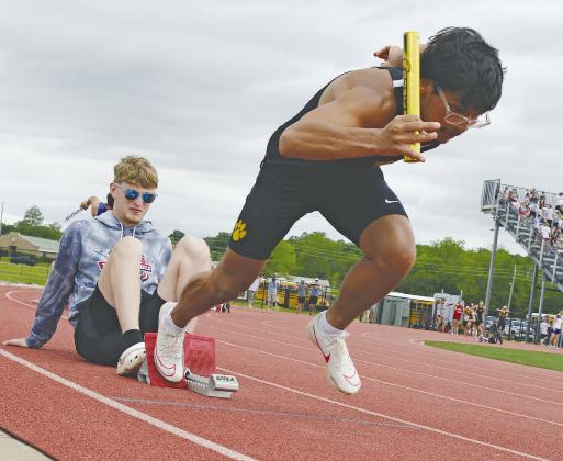 The OSSAA 3A/4A track meet was held May 3 and 4, both Marshall County schools attended. Top left photo: Cash Walker runs the hurdles. Top right photo: Arrody Comacho takes off running while Blayze Adams holds the blocks. Bottom left photo: Rafe Patterson participates in the relay. Bottom right photo: Avery Ludick give her all in the relay.
