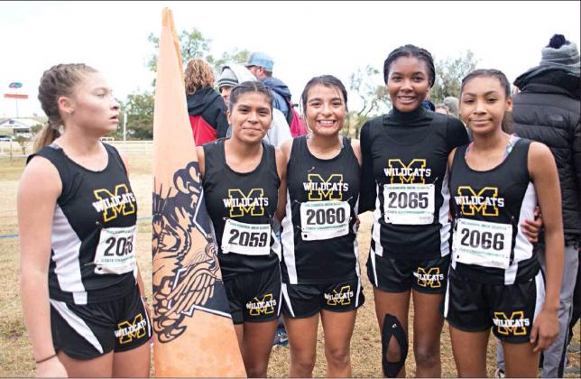 Brian Blansett • For The Madill Record From left to right: sophomore Destiney Adams, junior Valeria Calderon, junior Lala Flores, sophomore Joslyn Stumblingbear and freshman Mercedes Stumblingbear celeberate their team’s second place finish at the Class 4A Sttate Cross Country Meet on Oct. 26.