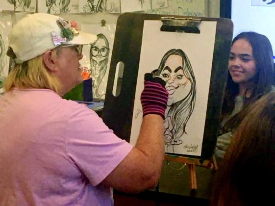 Teresa Farrington, AKA "The Okie Artist", artist visited a Kingston High School art class to hold a Caricature 101 class. She made some of the students